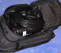 Trolley Reisekoffer ARAL\n\nFoto von Jrg Langer\n\nKommentar des Nutzers:\n\nDieser Trolley aus einer Punkte Aktion der ARAL und passend fr die kleine Studioblitzausstattung.\n\nWir haben hier reingepackt:\n\nHauptfach:\nStudioblitzleuchte 420Ws\nStudioblitzleuchte 260Ws\n(in einem Handtuch gegen Ste und Reibung etwas gesichert)\noben drber "kneulen" wir Schwarze und weie Stoffe die man im STudiobetrieb immer wieder mal brauchen kann.\n\nIm aufgesetzen Rucksack /der Fronttasche auf dem Trolley sind:\n\nStudioblitzleuchte klein 100Ws miit Spotvorsatz, 15 Meter Stromverlngerung, Steckdoesenleiste, Stromkabel fr die 3 Studioblitze\n\nIn der Fronttasche der Fronttasche ;-) sind dann:\n\n2 X-Sync Kabel 5m fr die 3 Blitze (der kleine und die groen nutzen unterschiedliche und Ersatz soll ja auch dabei sein ;-)\n\nHinten neben dem Trolleygestell sind dann zwei kleine Reflektorschirme verstaut. Die Stative und die Softboxen werden in Ihren eigenen Taschen transportiert und liegen gesondert im Kofferraum.