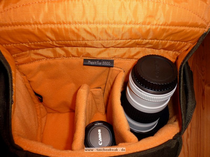 CRUMPLER MUFFIN TOP 5500\n\nFoto von Robert Mayr - VIELEN DANK!\n\nKommentar:\n\nvorab, es handelt sich um eine Crumpler Muffin Top 5500 in olive/orange die mit folgendem bestckt wird:\n- Canon 400D + BG-E3\n- Tamron 17-50 2.8 mit umgedreht angesetzter Geli\n- Canon 50 1.8 II\n- Canon 70-200 4.0 L mit umgedreht angesetzter Geli