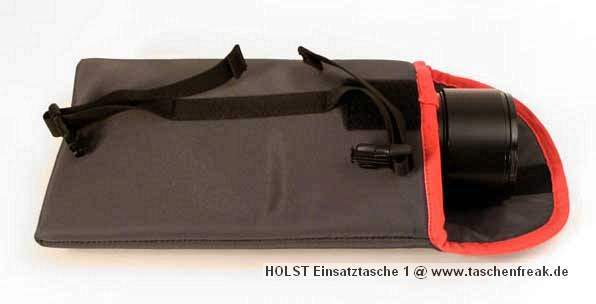 Foto von HInnerk Holst - VIELEN DANK DAFR!\n\nKommentar des Nutzers/Herstellers:\n\nDiese Tasche ist aus 420er Oxford-Nylon mit einer Schaumeinlage gefertigt und lsst sich nur im Oberfach des Fotorucksacks L ber Klettbnder und Spannriemen mit Schnellverschlssen befestigen.\n\nFarbe: grau mit rot \n\nAbmessungen\n\nDie Tasche fasst z.B. Objektive bis zu einem Durchmesser von 11 cm und 18 cm Lnge.