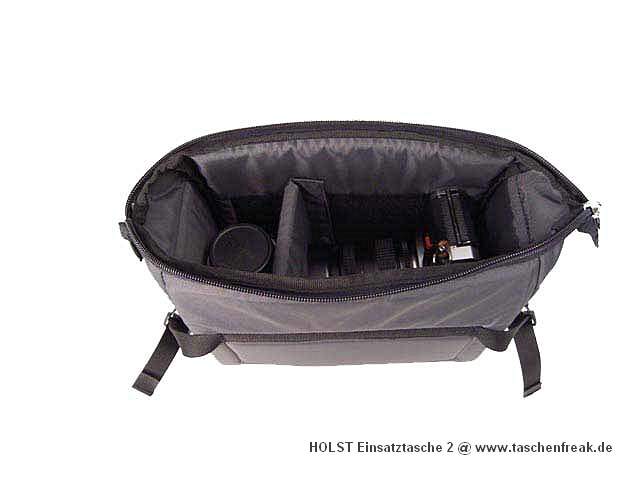 Foto von Hinnerk Holst - VIELEN DANK DAFR!\n\nKommentar des Nutzers/Herstellers:\n\nDiese Tasche ist aus 420er Oxford-Nylon mit einer Schaumeinlage gefertigt und lsst sich nur im Oberfach des Fotorucksacks L ber Klettbnder und Spannriemen mit Schnellverschlssen befestigen. \nZum Lieferumfang gehrt ein Teiler.\n\nFarbe: grau \n\nAbmessungen\n\nDiese Tasche ist quaderfrmig und hat die Innenabmessung von ca. 16 cm x 25 cm x 11 cm (HxBxT).