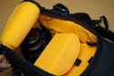 KATA 3N1-30\n\nFotos und Kommentar von Taschenfreak\n\nKommentar:\n\nDer KATA 3N1-20 ist uns beim Einkauf bei Saturn Hansa einfach so in den Wagen gesprungen und wollte nicht mehr aussteigen, also haben wir ihm im Taschenfreakheim Asyl gewährt. Und da dieser soo gut und brauchbar war haben wir nun den 3N1-30 mit der Stativhalterung geordert um etwas mehr verstauen zu können - im 3N1-30!!!\n\nDer sehr vielseitige ... ja was ist es eigentlich? Es ist ein Slingshot, es ist aber auch ein richtiger Rucksack - ja es ist ein "Convertible" an Slingshot und Rucksack.\n\nMan kann die beiden Rückengurte ganz normal wie bei einem Rucksack verwenden, kann diese aber auch quer verbinden und einen im ruckenfach verstecken so das es zum Slingshot wird.\n\nBeide Seiten lassen sich öffnen, ebenso wie der ganze Laderaum. \n\nWir haben testweise in dieses Teil folgende Ausrüstungsgegenstände verstaut. \n\nD3 mit 24-70 2.8 mit Geli umgedreht\n14-24 2.8\n70-200 mit Stativfuß mit Geli umgedreht\n50 1.4 mit Geli richtig aufegesetzt\n100 Micro 2.8 VR mit Geli umgedreht\nSB-900\n\nim Oberen Fach:\n2x SB-600 mit Bouncer in orig. Nikon Taschen\n1x SU-R800 (Remoteauslöser von Nikon) in orig. Tasche\nSpeicher\nAkkus\nCalifornia Sun-Sniper\n\nin den Seitentaschen:\nGarmin GPS\nIPhone\n\nAn der Stativhalterung:\nBenro Travel Angel mit Novoflex Ball 30 und Novoflex Panodrehset\n\nDamit ist der 3N1-30 wirklich "voll" aber noch gut nutzbar.\n\nEr ist vom Tragekomfort als Rucksack im "2 Gurt Betrieb" sehr bequem auf dem Rücken!\n\nDa die Gurte für einen Slingshot länger sein müssen ist der Rucksack auch für XXXXXXXL Menschen nutzbar da die Tragegurte extrem lang sind. Das macht auch ein "aushängen einer Schulter möglich und ein nach vorneswingen der Tasche um so an die Cam rann zu kommen.\n\nAuf Taschenfreak.de finden sie ebenso das kleinere Schwestermodel 3N1-20) und auch einen direkten Vergleich zwischen 3N1-20 und 3N1-30.\n\nIch hoffe es hilft Euch!\n\nLiebe Grüße\n\nJörg Langer\nwww.taschenfreak.de