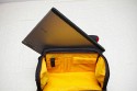 KATA 3N1-33\n\nFoto und Text von Lars Andresen - VIELEN DANK!\n\nKommentar:\n\nFotorucksack Kata 3N1-33 mit Daypack, Kamerafach und Laptopfach + Stativhalter STH-3N1\n\nDer 3n1-33 entspricht weitestgehend dem 3n1-30, als groe Neuerung ist ein Laptopfach hinzugekommen.\n\nDa dies mein erster Fotorucksack ist, habe ich leider keinen wirklichen Vergleich,\naber ich will dennoch mal versuchen hier einen berblick ber die Tasche zu geben.\n\nWas alles dabei war lsst sich auf dem ersten Bild recht gut erkennen:\nDer Rucksack, der Stativhalter und die obere Befestigungsschlaufe, \n2 groe Trennwnde, 5 kleine Trennwnde, der Regenschutz und die Speicherkartentasche.\n -Die beiden groen Trennwnde sind spiegelverkehrt, \n   d.h. es ist eine exakt spiegelverkehrte Einteilung des Rucksacks mglich.\n -Die kleinen Trennwnde sind alle gleich.\n -Der Regenschutz ist sich selbst seine Tasche.\n -Und die Speicherkartentasche hat Klettband an der Rckseite, \n   lsst sich also an vielen Stellen befestigen.\n\n\n### Tragesystem\n\nDas interessante an der Tasche ist ja das Tragesystem, wer mal nach der Tasche gegoogelt hat wird wissen warum.\nMan kann die Trger auf mehre Art- und Weisen verwenden:\n1. Wie einen normalen Rucksack.\n2. Im Sling mit entweder dem rechten oder dem linken Trger, je nach Belieben\n3. Mit den Trgern ber Kreuz, was in einem sehr festen Sitz des Rucksacks resultiert\n\n -Zu jeder Konfiguration kann man noch den eingebauten Beckengurt verwenden, womit sich der Rucksack dann endgltig nicht mehr bewegt ;-)\n -Nicht gebrauchte Trger lassen sich bequem hinter einer Polsterungsschicht wegklappen, das geht auch mit allen gleichzeitig.\n -Fr die, die es haben wollen: es gibt eine Lasche um den Rucksack auf einen Trolley zu stecken, \n	hier ist dann wohl das weg packen aller Trger ziemlich hilfreich.\n -Die Schnallen lassen sich sehr leichtgngig verstellen, wenn man sie senkrecht zur Gurtrichtung hlt.\n	Ebenso funktioniert das "Ziehen am Gurtende" zum Feststellen an allen Trgern problemlos.\n	Dafr halten die Schnallen in Normalposition wie eine 1, da rutsch nichts an Gurt wieder zurck, genau wie es sein soll.*\n -Unbenutzter Restgurt kann ein wenig verstaut werden:\n	Auf den Trgergurten gibt es zwei frei verschiebliche Gurtumschlieende Teile, in die mal die Gurte zurckschieben kann.\n	Fr die Beckengurte gibt es sowas nicht direkt sondern zur zwei Gummizugringe um die Gurte,\n	da stren lose Gurte aber auch bei weitem nicht so sehr, wie an den Trgern\n -Der beste Sitz ist aus meiner Sicht definitiv mit den Trgern ber Kreuz (+optional Beckengurt):\n	Die Tasche hat dort einfach den besten Halt. Die Armfreiheit wird nicht beeintrchtigt, \n	und die Tasche scheint auch genau darauf ausgelegt zu sein.\n	Es kann zudem schnell in den Sling gewechselt werden indem man einfach einen der beiden Trger lst\n\n*Ein Test war: Den Rucksack mit etwa 8 kg Gewicht an einer einzigen Schnalle festgehalten und hochgezogen: Es rutschte kein Gurt nach.\n\n\n### Laptopfach\n\nEin wenig gro fr meinen 13-Zller, aber in den 3n1-22 htte er nicht mehr reingepasst.\nKata liefert die Werte 42*27*4 (H*B*T), die ich soweit auch (als Maximalwerte) besttigen kann.\nAm Boden des Laptopfachs ist ein 2x3 cm Schaumstoffstreifen, der wohl das meiste abfedern drfte.\nZum Rcken hin gibt es drei Schichten:\nEinmal die Rckwand, dann eventuelle verstaute Trger und dann noch einmal die normale Rckenpolsterung.\nMeines Erachtens kann da soweit erstmal nichts durchkommen\nNur die Reiverschlsse knnten an den Seiten ein wenig weiter runtergehen.\n\n\n### Daypack\n\nEs lsst sich sehr weit ffnen, mit zwei etwas schwergngigeren Reiverschlssen (gehen halt um die Rundungen).\nDie beiden Seitentaschen haben jeweils nochmal eine recht unbedeutende einfache Netzunterteilung und teilen sich mit dem Daypack das Fach,\nhaben aber auch nicht sonderlich viel Stauraum, ein normalgroes Protemonnaie wrde wohl noch rein passen.\nDas Daypack ist recht gro, zwei 1,5l Eisteepackungen passen locker rein.\n\nIch hab einfach mal alles reingeschmissen was mir eingefallen ist, was man mitnehmen knnte:\nLadegert, Notizbuch, Portemonnaie, HTC Hero, Polfilter, Lenspen, Taschenlampe, \nLaptopnetzteil, Ministativ, Maus fr Laptop, Regenschutz.\nIn Netztasche: 2*4 Eneloops\nIn Seitentaschen: Selbstbau-Kabelauslser, Nahlinse in Case, MP3-Player, Raynox 250.\nUnd es war immernoch massig Platz. Mindestens eine Eisteepackung...\n\n\n### Kamerafach\n\nDie Unterteilung zwischen Kamerafach und Daypack erfolgt ber einen Zwischenboden, \nder sich dank eines Reiverschlusses auch in Richtung Laptopfach wegklappen lsst.\nVon daher kann man im Notfall auch mal berma transportieren.\nDas Fach selbst lsst sich wie gewohnt recht vielseitig einteilen.\nDie Mae des Fachs betragen 30*29,5*16 cm (HxBxT), es passt also auch mal etwas unfrmigeres rein.\n\nDas ganze Kamerafach wird von einem einzigen Reiverschluss verschlossen, auf diesem sind jedoch gleich 4 Schieber.\nJe zwei der Schieber befinden sich (im geschlossenen Zustand) an je einer der beiden groen Schnallen.\nZieht man die Tasche im Sling nach vorne, bspw. als Rechtshnder ber die linke Seite, \ndann kann man mit der linken Hand die Schnalle lsen und mit der anderen, mit einem Zug an der Schnalle, den Seiteneingriff aufziehen.\nDer Eingriff in das Kamerafach kann sich im Gebrauch auf die Seiteneingriffe beschrnken. \nDiese sind ausreichend gro dimensioniert, so dass man bei Zugriff von beiden Seiten an das ganze Fach ran kommt.\nNatrlich kann man das Fach auch komplett ffnen, wenn man z.b. die Trennwnde neu verstellen will.\nEine interessante Zusatzmglichkeit bieten die beiden groen Seitenwnde, diese haben an einem Ende jeweils eine Klappe, \ndie sich mit einem kleinen Klettpunkt verschlieen lsst. \n\nMglichkeiten um die Trennwnde zu befestigen finden sich am Boden und am Zwischenboden zum Daypack, \nzudem ziehen sich zwei Klettbnder ber die Rckwand (zum Laptopfach), sowie ber die beiden Seitenwnde.\nErscheint auf der ersten Blick eher wenig, aber da die Trennwnde ja selbst wieder neue Befestigungsmglichkeiten darstellen, \nvermisse ich eigentlich nichts.\nDie "Auenwand" hat lediglich zwei Befestigungslaschen im oberen Bereich fr eine Trennwand, am besten auf den Bildern angucken.\nDa die groen Seitenwnde genau gespiegelt vorliegen ist eine exakt spiegelverkehrte Einteilung des Fachs mglich.\n\nBei den Fotos ist jetzt ein Einteilungsversuch von mir mit drin, der sich spter jedoch als unpraktikabel herausgestellt hat.\n(Die Kamera passt in der Position nicht mit montiertem Blitz durch den Seiteneingriff)\n\n\n### Stativhalter\n\nZunchst zu den entsprechenden Bildern: \nAls ich die ersten Bilder geschossen hatte, war das Manfrotto 190XPROB mit 486RC2 noch nicht da, \ndaher ist auf einigen Bildern noch das minimal unpraktischere Sony Elevator zu sehen.\n\nDer Stativhalter ist standardmig nicht im Lieferumfang und kostet je nach Shop ~13 bis 20.\nDie ich keinen anderen Rucksack mit Stativhalter habe kann ich schlecht vergeichen, halte ihn aber fr recht brauchbar.\n\nDie Befestigung erfolgt ber drei Punkte, mit Klettband am D-Ring in der Mitte der Tasche, \nsowie mit zwei kleinen Gurten an den beiden Sicherungsschnallen am unteren Ende.\nDazu gibt es einen Befestigungsschlaufe, die das Stativ oben rum befestigt, diese wird mit einem Klettband an dem Handgriff \ndes Rucksacks befestigt, ist lngenverstellbar (Klett) und schliet mit einer Schnalle.\n\nIch befrchtete erst, dass das 190er zu gro sein wird, aber es scheint noch gerade so zu passen.\n\nDie Befestigungsschlaufe hlt das Stativ recht gut fest, auch ber Kopf (zumindest so, wie ich es befestigt habe).\n\nDie Grenangaben fr den Halter sind:\nHead Base Perimeter: 29 cm\nLeg Perimeter: 30 cm\nHeight: 48 cm (bezieht sich wohl auf die Hhe der Stativbeine)\nMax Tripod weight: 2 kg\n\nVerglichen mit dem 190er:\nDurchmesser an der Basis: 30 cm, wobei ich das Stativ nicht an der Stelle des grten Durchmessers befestige, von daher egal.\nBeindurchmesser: 29 cm (Maband um die dickste Stelle, also um die Befestigungshebel) -> passt\nHhe: Beinlnge 50 cm, bis zum Kopf 57 cm, mit Kopf: 65 cm -> passt\nGewicht: Mit Kugelkopf wiegt das 190er 2,2 kg, also leicht drber -> passt\n\nAuch wenn das Stativ durch die Befestigung am Handgriff ein bisschen nach links und rechts schwingen kann, \nkonnte ich beim tragen bis jetzt keine nennenswerten Einschrnkungen feststellen. \nLediglich im Sling, wenn man den Rucksack wieder auf den Rcken ziehen will \nmacht sich das zustzliche Gewicht so weit auen bemerkbar.