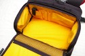 KATA 3N1-33\n\nFoto und Text von Lars Andresen - VIELEN DANK!\n\nKommentar:\n\nFotorucksack Kata 3N1-33 mit Daypack, Kamerafach und Laptopfach + Stativhalter STH-3N1\n\nDer 3n1-33 entspricht weitestgehend dem 3n1-30, als groe Neuerung ist ein Laptopfach hinzugekommen.\n\nDa dies mein erster Fotorucksack ist, habe ich leider keinen wirklichen Vergleich,\naber ich will dennoch mal versuchen hier einen berblick ber die Tasche zu geben.\n\nWas alles dabei war lsst sich auf dem ersten Bild recht gut erkennen:\nDer Rucksack, der Stativhalter und die obere Befestigungsschlaufe, \n2 groe Trennwnde, 5 kleine Trennwnde, der Regenschutz und die Speicherkartentasche.\n -Die beiden groen Trennwnde sind spiegelverkehrt, \n   d.h. es ist eine exakt spiegelverkehrte Einteilung des Rucksacks mglich.\n -Die kleinen Trennwnde sind alle gleich.\n -Der Regenschutz ist sich selbst seine Tasche.\n -Und die Speicherkartentasche hat Klettband an der Rckseite, \n   lsst sich also an vielen Stellen befestigen.\n\n\n### Tragesystem\n\nDas interessante an der Tasche ist ja das Tragesystem, wer mal nach der Tasche gegoogelt hat wird wissen warum.\nMan kann die Trger auf mehre Art- und Weisen verwenden:\n1. Wie einen normalen Rucksack.\n2. Im Sling mit entweder dem rechten oder dem linken Trger, je nach Belieben\n3. Mit den Trgern ber Kreuz, was in einem sehr festen Sitz des Rucksacks resultiert\n\n -Zu jeder Konfiguration kann man noch den eingebauten Beckengurt verwenden, womit sich der Rucksack dann endgltig nicht mehr bewegt ;-)\n -Nicht gebrauchte Trger lassen sich bequem hinter einer Polsterungsschicht wegklappen, das geht auch mit allen gleichzeitig.\n -Fr die, die es haben wollen: es gibt eine Lasche um den Rucksack auf einen Trolley zu stecken, \n	hier ist dann wohl das weg packen aller Trger ziemlich hilfreich.\n -Die Schnallen lassen sich sehr leichtgngig verstellen, wenn man sie senkrecht zur Gurtrichtung hlt.\n	Ebenso funktioniert das "Ziehen am Gurtende" zum Feststellen an allen Trgern problemlos.\n	Dafr halten die Schnallen in Normalposition wie eine 1, da rutsch nichts an Gurt wieder zurck, genau wie es sein soll.*\n -Unbenutzter Restgurt kann ein wenig verstaut werden:\n	Auf den Trgergurten gibt es zwei frei verschiebliche Gurtumschlieende Teile, in die mal die Gurte zurckschieben kann.\n	Fr die Beckengurte gibt es sowas nicht direkt sondern zur zwei Gummizugringe um die Gurte,\n	da stren lose Gurte aber auch bei weitem nicht so sehr, wie an den Trgern\n -Der beste Sitz ist aus meiner Sicht definitiv mit den Trgern ber Kreuz (+optional Beckengurt):\n	Die Tasche hat dort einfach den besten Halt. Die Armfreiheit wird nicht beeintrchtigt, \n	und die Tasche scheint auch genau darauf ausgelegt zu sein.\n	Es kann zudem schnell in den Sling gewechselt werden indem man einfach einen der beiden Trger lst\n\n*Ein Test war: Den Rucksack mit etwa 8 kg Gewicht an einer einzigen Schnalle festgehalten und hochgezogen: Es rutschte kein Gurt nach.\n\n\n### Laptopfach\n\nEin wenig gro fr meinen 13-Zller, aber in den 3n1-22 htte er nicht mehr reingepasst.\nKata liefert die Werte 42*27*4 (H*B*T), die ich soweit auch (als Maximalwerte) besttigen kann.\nAm Boden des Laptopfachs ist ein 2x3 cm Schaumstoffstreifen, der wohl das meiste abfedern drfte.\nZum Rcken hin gibt es drei Schichten:\nEinmal die Rckwand, dann eventuelle verstaute Trger und dann noch einmal die normale Rckenpolsterung.\nMeines Erachtens kann da soweit erstmal nichts durchkommen\nNur die Reiverschlsse knnten an den Seiten ein wenig weiter runtergehen.\n\n\n### Daypack\n\nEs lsst sich sehr weit ffnen, mit zwei etwas schwergngigeren Reiverschlssen (gehen halt um die Rundungen).\nDie beiden Seitentaschen haben jeweils nochmal eine recht unbedeutende einfache Netzunterteilung und teilen sich mit dem Daypack das Fach,\nhaben aber auch nicht sonderlich viel Stauraum, ein normalgroes Protemonnaie wrde wohl noch rein passen.\nDas Daypack ist recht gro, zwei 1,5l Eisteepackungen passen locker rein.\n\nIch hab einfach mal alles reingeschmissen was mir eingefallen ist, was man mitnehmen knnte:\nLadegert, Notizbuch, Portemonnaie, HTC Hero, Polfilter, Lenspen, Taschenlampe, \nLaptopnetzteil, Ministativ, Maus fr Laptop, Regenschutz.\nIn Netztasche: 2*4 Eneloops\nIn Seitentaschen: Selbstbau-Kabelauslser, Nahlinse in Case, MP3-Player, Raynox 250.\nUnd es war immernoch massig Platz. Mindestens eine Eisteepackung...\n\n\n### Kamerafach\n\nDie Unterteilung zwischen Kamerafach und Daypack erfolgt ber einen Zwischenboden, \nder sich dank eines Reiverschlusses auch in Richtung Laptopfach wegklappen lsst.\nVon daher kann man im Notfall auch mal berma transportieren.\nDas Fach selbst lsst sich wie gewohnt recht vielseitig einteilen.\nDie Mae des Fachs betragen 30*29,5*16 cm (HxBxT), es passt also auch mal etwas unfrmigeres rein.\n\nDas ganze Kamerafach wird von einem einzigen Reiverschluss verschlossen, auf diesem sind jedoch gleich 4 Schieber.\nJe zwei der Schieber befinden sich (im geschlossenen Zustand) an je einer der beiden groen Schnallen.\nZieht man die Tasche im Sling nach vorne, bspw. als Rechtshnder ber die linke Seite, \ndann kann man mit der linken Hand die Schnalle lsen und mit der anderen, mit einem Zug an der Schnalle, den Seiteneingriff aufziehen.\nDer Eingriff in das Kamerafach kann sich im Gebrauch auf die Seiteneingriffe beschrnken. \nDiese sind ausreichend gro dimensioniert, so dass man bei Zugriff von beiden Seiten an das ganze Fach ran kommt.\nNatrlich kann man das Fach auch komplett ffnen, wenn man z.b. die Trennwnde neu verstellen will.\nEine interessante Zusatzmglichkeit bieten die beiden groen Seitenwnde, diese haben an einem Ende jeweils eine Klappe, \ndie sich mit einem kleinen Klettpunkt verschlieen lsst. \n\nMglichkeiten um die Trennwnde zu befestigen finden sich am Boden und am Zwischenboden zum Daypack, \nzudem ziehen sich zwei Klettbnder ber die Rckwand (zum Laptopfach), sowie ber die beiden Seitenwnde.\nErscheint auf der ersten Blick eher wenig, aber da die Trennwnde ja selbst wieder neue Befestigungsmglichkeiten darstellen, \nvermisse ich eigentlich nichts.\nDie "Auenwand" hat lediglich zwei Befestigungslaschen im oberen Bereich fr eine Trennwand, am besten auf den Bildern angucken.\nDa die groen Seitenwnde genau gespiegelt vorliegen ist eine exakt spiegelverkehrte Einteilung des Fachs mglich.\n\nBei den Fotos ist jetzt ein Einteilungsversuch von mir mit drin, der sich spter jedoch als unpraktikabel herausgestellt hat.\n(Die Kamera passt in der Position nicht mit montiertem Blitz durch den Seiteneingriff)\n\n\n### Stativhalter\n\nZunchst zu den entsprechenden Bildern: \nAls ich die ersten Bilder geschossen hatte, war das Manfrotto 190XPROB mit 486RC2 noch nicht da, \ndaher ist auf einigen Bildern noch das minimal unpraktischere Sony Elevator zu sehen.\n\nDer Stativhalter ist standardmig nicht im Lieferumfang und kostet je nach Shop ~13 bis 20.\nDie ich keinen anderen Rucksack mit Stativhalter habe kann ich schlecht vergeichen, halte ihn aber fr recht brauchbar.\n\nDie Befestigung erfolgt ber drei Punkte, mit Klettband am D-Ring in der Mitte der Tasche, \nsowie mit zwei kleinen Gurten an den beiden Sicherungsschnallen am unteren Ende.\nDazu gibt es einen Befestigungsschlaufe, die das Stativ oben rum befestigt, diese wird mit einem Klettband an dem Handgriff \ndes Rucksacks befestigt, ist lngenverstellbar (Klett) und schliet mit einer Schnalle.\n\nIch befrchtete erst, dass das 190er zu gro sein wird, aber es scheint noch gerade so zu passen.\n\nDie Befestigungsschlaufe hlt das Stativ recht gut fest, auch ber Kopf (zumindest so, wie ich es befestigt habe).\n\nDie Grenangaben fr den Halter sind:\nHead Base Perimeter: 29 cm\nLeg Perimeter: 30 cm\nHeight: 48 cm (bezieht sich wohl auf die Hhe der Stativbeine)\nMax Tripod weight: 2 kg\n\nVerglichen mit dem 190er:\nDurchmesser an der Basis: 30 cm, wobei ich das Stativ nicht an der Stelle des grten Durchmessers befestige, von daher egal.\nBeindurchmesser: 29 cm (Maband um die dickste Stelle, also um die Befestigungshebel) -> passt\nHhe: Beinlnge 50 cm, bis zum Kopf 57 cm, mit Kopf: 65 cm -> passt\nGewicht: Mit Kugelkopf wiegt das 190er 2,2 kg, also leicht drber -> passt\n\nAuch wenn das Stativ durch die Befestigung am Handgriff ein bisschen nach links und rechts schwingen kann, \nkonnte ich beim tragen bis jetzt keine nennenswerten Einschrnkungen feststellen. \nLediglich im Sling, wenn man den Rucksack wieder auf den Rcken ziehen will \nmacht sich das zustzliche Gewicht so weit auen bemerkbar.