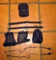 KATA HB-207\n\nFoto von Michael Reiff - VIELEN DANK!\n\nKommentar des Nutzers:\n\nGroesszuegig gepackt ohne irgendwtwas quetschen zu muessen.\n\nBeladung ist, glaube ich ersichtlich.\n\nder Rucksack verfuegt ueber ein Laptopfach fuer 17" incl. eines anklettbaren Behaelters fuer 8 CD/DVD und eines Teilers.\n\nDas abgebildete Zubehoer von oben nach unten:\n\nZusatzlicher Stativhalter, kann in der Mitte/aussen am Rucksack angebracht werden, damit das Stativ mittig getragen werden kann. Ragt dann aber nach unten aus (wie beim Lowe Pro Compu Trekker)\nDas Stativ kann aber seitlich am Rucksack in den offenen Taschen bequem angebracht werden (Strap liegt bei), die andere Tasche fasst dann eine Wasserflasche.\n\n2 Straps, damit koennen die mitgelieferten Kamerahalterungen zu einem Nackenband verbunden werden.\n\nZwei klettbare Zubehoerbeutel und rechts das ist die mitgelieferte Regenhuelle.\n\nDarunter sind die Kamerastrapsr, sie werden an der Kamera (wie Euer Nackengurt) befestigt und mit Hilfe von 2 Karabinern an den Trageriemen des Rucksacks befestigt,\nsomit haengt die Kamera vor dem Bauch, aber am Rucksack (was immer das auch bringen mag).\n\nDer Rucksack wiegt leer 3,7 kgs mit allem mitgelieferten Zubehoer. Aufgrund seiner Verstellmeoglichkeiten in der Hoehe, auch fuer grosse Leute bequem zu tragen. Der Beckengurt verfuegt\nuber zwei Falten, somit kann er komplett weggeklappt werden, kann aber auch ganz aus der Halterung genommen werden.\n\nEs gibt auch Minuspunkte: Der Handgriff ist an der oberen Klappe befestigt und somit wird der Rucksack vom Reissverschluss getragen...ich werde Ihn wohl direkt abmachen, damit man nicht in Versuchung kommt.\nda sollte Kata nochmals nachbessern.
