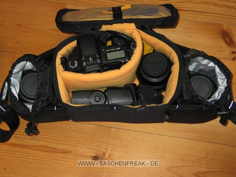 Kata W92 - Canon Edition\n\nFoto von Hotte - DANKE DIR!\n\nKommentar des Nutzers:\n\nHi Jrg,\nanbei die gewnschten pics, auf die Schnelle gemacht.\nHier handelt es sich um die "special edition" von Canon, basierend auf der W-92. Zwischen Blitz und 85er gehrt noch einer der beiden zustzlichen, serienmigen Klett-Teiler, hatte ich gerade nicht zur Hand.\nMorgen werde ich das Teil mal bei einer Veranstaltung in der Praxis testen, in Verbindung mit der kurzen Tamrac-Weste, und auf Wunsch berichten.\n\n20D mit BG, 1,8/85, 17-85, 2/135, alle mit Geli\n\n430EX, Akkus fr Cam und Blitz, CFs, Filter und Tuch und Kleinkram.\n\nGru\nHotte