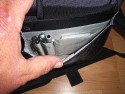 LOWEPRO CLASSIFIED 250AW\n\nFoto und Text von Ralf Steck - VIELEN DANK!\n\nKommentar:\n\nHallo Jrg,\n\nnachdem ich monatelang Deine Seiten durchgesehen habe, hier mal ein Beitrag von mir: Fotos zur Lowepro Classified 250AW. \n\nDie Tasche ist schon sehr gro, aber es geht eben auch viel rein. Ich bin freier Journalist und suchte nach einer Tasche fr Laptop + Fotoausrstung + Schreibmappe + Platz fr Unterlagen, beispielsweise wenn ich auf Pressekonferenzen gehe. Im Kamerafach ist noch einiges an Platz, beispielsweise fr ein Buch und Notklamotten, wenns mal wieder mit dem Flugzeug irgendwohin geht. Die Tasche ist allerdings offiziell zu gro frs Handgepck, gepackt wie auf den Bildern zu sehen sind die Mae 45 x 29 x 29, wobei es mglich sein sollte, die Tasche auf Handgepcktaugliche 20cm Breite zu drcken, wenn die Schreibmappe drauen ist. Auf der Reise ist die Lasche frs anbringen am Koffertrolley praktisch. Hinten dran ist nochmal ein frei zugngliches, mit Reiverschluss gesichertes Fach dran, in das A4-Unterlagen passen, aber beispielsweise auch Bordkarten, Pass usw. griffbereit und trotzdem sicher transportiert werden knnen.\n\nDas Fotofach und die Trenner sind komplett mit dem weichen Klettstoff belegt, so dass man die Tasche vllig frei einrichten kann, beispielsweise auch zweistckig. Das EF-S 55-250 passt mit aufgesetzter Geli aufrecht rein, ebenso der Blitz (Canon Speedlite 580 EX-II) mit Bouncer drauf. Zwei Microfasertcher, die an kleinen, klettbaren Taschen sitzen, schtzen die Kamera.\n\nDas linke vordere Fach ist innen mit samtartigem Stoff gefttert, so dass der IPod schn sicher transportiert werden kann. Es ist noch eine Rolltasche fr bis zu 9 CF-Karten dabei, die ich aber nicht benutze.\n\nDie Tasche sieht, wie ich finde, elegant, anzugtauglich und nicht fototaschenmig aus, auch wenn sie durch die groe Tiefe schon etwas sperrig wirkt. Sie lsst sich angenehm tragen und ich habe sie auch schon mit dem Zusatzgurt auf dem Rad getragen. Dabei fllt auf, dass das Schulterpolster fest am Gurt ist, wenn man die Tasche auf den Rcken schiebt, hat man das Polster an der Brust statt oben auf der Schulter.\n\n--\nViele Gre vom Bodensee,\nRalf Steck - Die Textwerkstatt