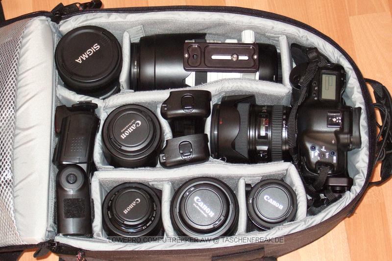 Foto von Jrg Langer\n\nKommentar des Nutzers:\n\nDieser Lowepro Compu Trekker ist eine angenehme Mischung aus Packesel und dennoch tragbarem und relativ kleinem Rucksack, den man auch ohne Diskussionen in nahezu jeder Fluggesellschaft mitnehmen kann.\n\nDas Notebookfach fasst laut Herstellerangabe die meisten 15,4" Notebooks. Fr 17" Notebooks solle man den Compu Trekker Plus AW whlen, der in Summe wesentlich grer aber auch wieder deutlich aufflliger ist.,\n\nWir haben in diesem LP CT AW reingepackt:\n\nInnenraum Hauptfach:\nCanon 1D mit RRS L Winkel und angesetztem Canon EF 24-105 L IS\nCanon 100-400 mit Geli und Stativschelle mit Kirk Wechselplatte\nCanon 100 2,8 USM Makro\nCanon 35 2.0 mit Geli (darunter Winkelsucher C)\nCanon 50 1,8 II (Geli liegt im 100-400er Fach) (darunter 8x AA Akkus)\nCanon 85 1,8 mit Geli\nSigma 12-24\nCanon 580 EX Blitz (darunter liegt der 430EX)\n2x Ersatzakku fr Canon 1D NP-E3\n\nIn den beiden oberen innentaschen des Deckels:\nJeweils 1x GEPE Card Safe mit jeweils 4x CF Cards\n\nIn den groen Deckelinnenfach:\nTimer Fernbedienung, Wasserwaage fr Blitzschuh, Leefolie fr beide Blitzgerte, 2 Putztcjer\n\nDeckelauenfach:\nLowepro Filtertasche\nLumiquest Pro Max Bouncer System\nGraukarte\nX-Drive 6230 im Peli Case\nCanon ST-E2\nMllscke\nLenspen