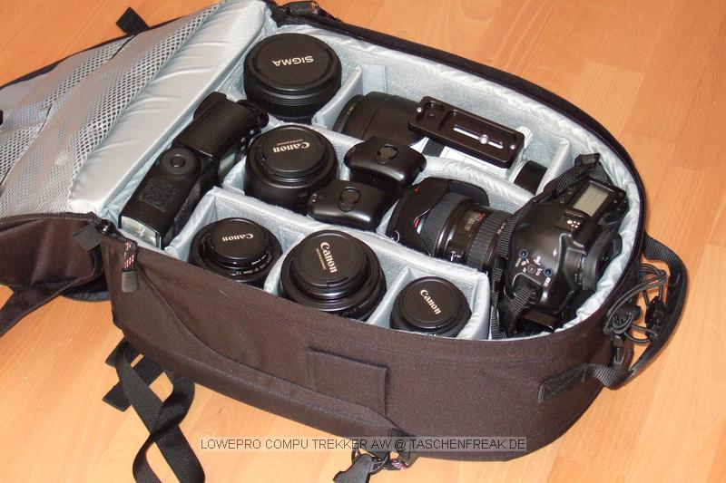 Foto von Jörg Langer\n\nKommentar des Nutzers:\n\nDieser Lowepro Compu Trekker ist eine angenehme Mischung aus Packesel und dennoch tragbarem und relativ kleinem Rucksack, den man auch ohne Diskussionen in nahezu jeder Fluggesellschaft mitnehmen kann.\n\nDas Notebookfach fasst laut Herstellerangabe die meisten 15,4" Notebooks. Für 17" Notebooks solle man den Compu Trekker Plus AW wählen, der in Summe wesentlich größer aber auch wieder deutlich auffälliger ist.,\n\nWir haben in diesem LP CT AW reingepackt:\n\nInnenraum Hauptfach:\nCanon 1D mit RRS L Winkel und angesetztem Canon EF 24-105 L IS\nCanon 100-400 mit Geli und Stativschelle mit Kirk Wechselplatte\nCanon 100 2,8 USM Makro\nCanon 35 2.0 mit Geli (darunter Winkelsucher C)\nCanon 50 1,8 II (Geli liegt im 100-400er Fach) (darunter 8x AA Akkus)\nCanon 85 1,8 mit Geli\nSigma 12-24\nCanon 580 EX Blitz (darunter liegt der 430EX)\n2x Ersatzakku für Canon 1D NP-E3\n\nIn den beiden oberen innentaschen des Deckels:\nJeweils 1x GEPE Card Safe mit jeweils 4x CF Cards\n\nIn den großen Deckelinnenfach:\nTimer Fernbedienung, Wasserwaage für Blitzschuh, Leefolie für beide Blitzgeräte, 2 Putztücjer\n\nDeckelaußenfach:\nLowepro Filtertasche\nLumiquest Pro Max Bouncer System\nGraukarte\nX-Drive 6230 im Peli Case\nCanon ST-E2\nMüllsäcke\nLenspen