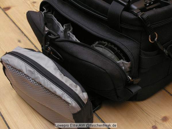Foto von Ralf Neumann - VIELEN DANK!\n\nKommentar des Nutzers:\n\nLowepro Elite AW\nSehr robuste Tasche fr die kleinere Ausrstung. DSLR mit 4 Objektiven plus Blitz passt prima (meine Sigma SD10 passt auch mit angesetztem Batteriefach wenn ich in die mittleren Fcher kurze Objektive packe).\nWenn die Tasche einen Nachteil hat, ist es die Unterteilung der Vordertasche, die dadurch doch recht eng wird. Viele empfinden dies anders, ich bin jedoch kein Freund von vielen kleinen Fchern. AW steht bei Lowepro fr eine Art Regencape, das in dem rckwrtigen Fach untergebracht ist. Der Deckel lappt ber und schtzt auch ohne das Regencape gut vor Feuchtigkeit. Recht hoher Preis, der jedoch meiner Meinung nach durch die Verarbeitung gerechtfertigt ist. S&F Zubehr kann an den Seiten angesetzt werden.