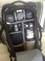 LOWEPRO FLIPSIDE 500\n\nFoto und Text von Lars Brückler - VIELEN DANK!\n\nKommentar:\n\nEs war mal wieder einer dieser Abende wo man eigentlich nichts zu tun hat und einfach so vollkommen unmotiviert im Netz surft. Das kommt zwar nicht oft vor, aber eben doch ab und an.\n\nDas eine oder andere Bierchen war schon geleert, als ich bei Klaus Bothe auf der Seite angelangte und wie jeden Tag die Kleinanzeigen bei Isarfoto checkte. Was sahen meine müden Augen da? Einen Flipside.. was? 500? Das muss doch ein Tippfehler gewesen sein, dachte ich mir. Nun möchte ich behaupten, dass ich mich im Lowepro-Sortiment auskenne, aber von einem Flipside 500 AW habe ich noch nie etwas gehört.\n \nSchon mehrfach hatte ich im Rahmen meiner beruflichen Tätigkeit den Flipside 400 AW in der Hand und habe mich schon oft geärgert, dass dieser außerordentlich gute Rucksack eine Nummer zu klein ist. Aber wenn es etwas nun mal nicht gibt, da nützt auch Fluchen nichts. Schwamm drüber. \n \nDer Blick ging schon wieder Richtung ThinkTankPhoto, denn irgendein Rucksack für das 300er 2.8 L musste her. Immer nur Trolley war nichts und in den Aero 80 passt es zwar rein, aber es steht quasi in einem großen Fach ohne jeglichen Halt. Also Mist! Außerdem passen dann keine anderen Linsen mehr hinein.\n \nNun, ich recherchierte also ein wenig über den 500 AW und siehe da, es gibt ihn wirklich. Es handelt sich bei dem Rucksack um ein limitiertes Sondermodell, welches Lowepro zu den olympischen Winterspielen an Profifotografen (offenbar) verschenkt hatte. Zu kaufen gibt es den Rucksack nicht. Ich habe eine einzige chinesische Seite gefunden, die den Rucksack für schlappe 4083 Hongkong-Dollar vertreibt. Das entspricht in richtigem Geld 406 Euro + Versand und Tax. Das nenne ich mal eine Ansage!\n\nIch bin mittlerweile über den Punkt hinaus, wo ich mir über die Preise von Fotozubehör den Kopf zerbreche, geschweige denn mich darüber aufrege.\n\nInteressant ist, dass LowePro nur 1200 Stück von den Rucksäcken produziert hat. Da stellt sich natürlich die Frage, wie wirtschaftlich so etwas ist. Meiner hat die Nummer 109/1200. Wie toll!\n \nGenug Gelaber, kommen wir zum Rucksack:\n \nErstes Befummeln:\n \nDer erste Eindruck ist wie bei jedem LowePro Produkt erstklassig. Lange habe ich darüber nachgedacht, wer denn nun eigentlich die besseren Produkte macht, LowePro oder Tamrac. Oft ist das Preisniveau sehr ähnlich aber die Verarbeitung geht in den meisten Fällen an LowePro. Diese Erkenntnis manifestiert sich auch im Flipside 500 AW. Die Tasche ist wahnsinnig gut gepolstert und die Größe ist für meine Körperhöhe ideal. Er wirkt auf den ersten Blick nicht zu wuchtig und macht einen hochwertigen Eindruck.\n \nNegatives fiel mir erstmal nicht auf, außer ein NPS Logo, was für mich als Canoniero natürlich ein No-Go ist. Aber das soll mich nicht weiter stören, Patch drüber nähen und gut ist!\n \nAusstattung: \n\nMittlerweile habe ich gelernt, dass es einige wichtige Kriterien gibt, die ein Rucksack erfüllen muss damit er im täglichen Einsatz bestehen kann.\n \nNeben dem Schutz der Ausrüstung sind das vor allem Komfortmerkmale wie ein ordentlich gepolsterter Beckengurt oder breite und weiche Schultergurte. Beides bietet der Flipside 500 AW und hinterlässt somit schonmal einen guten Eindruck. Das modische Äußere ist ebenfalls angenehm, wenngleich es mir lieber gewesen wäre, wenn es den 500 AW in dem sehr schönen Grünton des 400 AW gegeben hätte. Alles Gute ist aber nie beisammen und bei einer Auflage von nur 1200 Stück WELTWEIT ist es wahrscheinlich nicht machbar gewesen auch noch Farbwünsche zu berücksichtigen.\n \nWichtig für mich ist, dass ich mein 13“ MacbookPro immer dabei haben kann. Dies ist im Flipside auf gleich 2 verschiedene Varianten möglich. Zum einen besitzt der Rucksack ein großräumiges Frontfach in welches der Laptop reinpasst. Zum Anderen wäre auch im Innenraum noch Platz für das gute Stück. Wie praktisch letzteres bei der Entnahme der Kamera am Ende noch ist, das mag ich jetzt noch nicht einschätzen.\n\nWie jeder Rucksack von Lowepro ist auch der 500 Aw mit der LowePro - Stativhalterung versehen. Diese erfüllt ihren Zweck, ist aber nicht besonders ansehnlich. Das kann TTP deutlich besser. Dafür hat die LowePro Stativhalterung den großen Vorteil, dass man sie einfach einklappen und hinter einem Verschluss verschwinden lassen kann. Das ist pfiffig und hat sich als sinnvoll herausgestellt.\n \nSollte es von oben mal richtig runter schütten, so ist auch das kein Problem, denn der Rucksack verfügt über ein AW (All Weather) Cover, welches sich schon hundertfach bewährt hat. Ich nehme an, dass da nichts geändert wurde zu allen anderen modernen LowePro - Taschen. Also, bewährte Technik... wieso nicht? Man muss das Rad ja nicht jedes Mal neu erfinden. Besser wäre es jedoch, wenn es abnehmbar wäre. Ich wette aber, dass unzählige Fotografen das Teil dann wieder zuhause vergessen und dann fluchend im Regen stehen ^^ Warum soll es denn anderen besser gehen als mir? Ich denke auch an alles möglich, vergesse aber oftmals das wichtigste (Eintrittskarten, Pass, Jahreskarten etc.)\n \nAuch Kleinigkeiten wie das Visitenkarten-Fach, die Speicherkarten-Fächer usw. sind nett, aber weder außergewöhnlich noch für mich in irgendeiner Weise nutzbar. Auch das kann TTP besser ;-) Aber wenn es schonmal da ist, rausschneiden muss man es ja nicht unbedingt.\n \nDer Innenraum:\n \nMan mag es kaum glauben, aber im Flipside 500 AW hätte sogar eine Linse der Kategorie 400/2.8 L Platz. Das obere Bild zeigt, wieviel Ausrüstung tatsächlich in den Rucksack passt. Ich war sehr erstaunt.\n \nFolgende Ausrüstung findet im Innenraum (ohne Außentaschen) Platz:\n \nCanon EOS 40D Body + BG-E2N\nCanon EOS 550D Body + BG-E8\nSigma 10-20 mm 4-5,6 + Geli\nSigma 18-50 mm 2,8-4,5 + Geli\nCanon 70-200 F4 L USM + Geli\nCanon EF 300 mm 2,8 L USM  mit umgedrehter Geli\nCanon EF Extender 1,4x II\n2x Canon Blitzgerät (580 EX und 420 EX in eigener Hülle)\nSigma Objektiv-Köcher (vom 10-20) mit Ladegeräten etc.\nHama Trackpack mit 16x Eneloop Akku\n\nDas ist schon ganz ordentlich. Sogar alle Ladegeräte (vom MPB, BC700, Canon Ladegeräte für beide Kameras) passen noch in den Innenraum. Das liegt vor allem an der Tiefe des Rucksackes, die groß genug ist, das 70-200er F4 stehend darin zu transportieren. 2 cm weniger und das wäre nicht gegangen. \n\nIn die Außentaschen passen locker jeweils 1 Flasche Wasser mit 1,5 l oder (für diejenigen, die früh duschen und kein Wasser mit rumschleppen müssen :-) ... 2 Flaschen Bier ^^\n\nDie Flipside-Technik:\n \nLaut LowePro soll man in der Lage sein, den Rucksack nach vorn zu drehen und durch den rückseitigen Deckel Zugriff auf die Ausrüstung zu haben. Das mag bei leichten Ausrüstungen klappen, bei meinen 14 kg ohne Getränke und Stativ (mehr Kilos passen ins Hauptfach nicht rein) geht das schon nicht mehr. Ich habe immer Angst, dass es den Beckengurt wegreißt. Was dann das Resultat wäre, dass will ich mir gar nicht ausmalen.\n \nKritikpunkte:\n \nEs gibt natürlich auch Dinge, die mir nicht ganz so gut gefallen. Zum einen ist da die eingeschränkte Farbwahl und die Tatsache, dass man den Rucksack nicht frei kaufen kann. Zum anderen könnte man die Stativ - Halterung noch optimieren. Ich werde mein CT-3442 wohl wieder an der Seite transportieren, wie bei jedem anderen Rucksack auch. Beckengurte sind schön, aber schön wäre es auch, wenn man diese auch abnehmen könnte. Ab und an stören sie dann doch ein wenig aber wenn´s nicht geht... Wurscht!\n \nFazit:\n \nMal wieder ein toller Rucksack, vollgestopft mit tollen Features. Wem der 400er nicht reicht, der wird mit dem 500er AW glücklich. Der hohe Anschaffungswiderstand schreckt ein wenig ab, aber Exklusivität hat eben ihren Preis. Ich habe den Rucksack täglich im Einsatz beim Wandern und auf dem Bike. Bei beiden Einsatzbereichen macht er eine gute Figur und ich würde ihn jederzeit wieder kaufen.\n \nWie viel jeder Einzelne dann am Ende bereit ist zu zahlen, das hängt sicher davon ab, wie gut die eigenen Anforderungen von dem Rucksack erfüllt werden und was einem die Exklusivität wert ist. Letzteres interessiert mich gar nicht aber wenn es nunmal passt, dann kann es auch 2 Euro mehr kosten.\n \nBei Ebay habe ich nicht eine einzige beendete Auktion gefunden, es sollte also nicht leicht werden den LowePro Flipside 500 AW auf dem Gebrauchtmarkt zu finden.