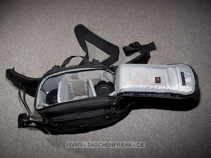 LOWEPRO INVERSE 200 AW\n\nFoto und Kommentar von Christian Toelle - VIELEN DANK!\n\nKommentar:\n\nHi Jrg,\n\nanbei ein paar Bilder der Inverse 200 AW mit Kamera. Es passt hinein eine 40D mit BG und 17-85 mit Geli, 2 Objektive wie das 50 1.4, 100 Makro, beides mit Geli und ein Wenig Kleinkram. Mit etwas Druck geht auch noch ein Blitz hinein. Schne, kompakte Bauchtasche mit Schulterriemen als Alternative, oder Lastverteiler. Sehr praktisch ist der Schulterriemen auch beim Objektivwechsel.\n\nGru Christian