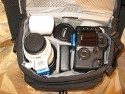 LOWEPRO NOVA 4 AW\n\nFoto von Dirk Volkmann - VIELEN DANK!\n\nKommentar des Nutzers:\n\nLowepro Nova 4\n \nDas oft unterschtzte Schtzchen....einigermassen gut ausgenutzt.\n \nEs geht sogar noch zu wie man auf dem letzten Bild sieht.\n \nHier mal die Inhaltsangabe:\n \n1. Canon 580EX mit Omnibounce\n \n2. Canon 100-400er mit umgedrehter Geli\n \n3. Canon 10-22er\n \n4. Nexto Tanker 80 GB\n \n5. Canon 30 D mit angesetztem 17-85er und richtig herum angesetzter Geli (Ein Batteriegriff wrde auch noch passen)\n \n6. in den Fchern neben/unter der Cam - Handbelichtungsmesser und\n \n7. Canon Winkelsucher C\n \n8. Lumiquest Ultrasoft\n \n9. Geli vom 10-22er\n \n10. Canon Nahlinse\n \n11. Aussentaschen (leider keine richtigen sondern nur dieses Netzgewebe mit Gummi) Batterien fr den Blitz (ja Batterien, die kann  \n   ich ein Jahr mit mir rumschleppen und wenn ich sie brauche hab ich Saft, ganz im gegensatz zu Akkus)\n \n12. Polfilter 77 67mm\n \n13. Vortasche, kleinzeug wie Speicherkarten, Kameraakkus, nochmal Batterien fr den Blitz, Blasebalg, Lenspen,     Kuli, \nHandy.............usw \n \n14. Hintere Tasche - Aldi Prservativ.............