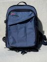LOWEPRO PHOTO TREKKER AW\n\nFoto von Dieter Schrder - VIELEN DANK!\n\nKommentar des Nutzers:\n\nHallo ,\n\nHier kommen nun weitere Bilder fr ihre Galerie.\n\nNach Prfung ihrer Seite sind diese bisher nicht vertreten.\n\n \n\n2. PhotoTrecker AW von Lowepro\n\nErste Ausgabe des PhotoTrecker AW\n \n\nBild 2 : von Vorn , Zwei Vorfcher, in das groe passt eine Menge rein wegen der Falte ( z.B. auch ein Notebook15,4Zoll mit Schutzhlle)\nBild 3+ 4 von den Seiten , sie sind gleich und haben eine Menge Schlaufen zur Befestigung\nBild 5 :  von hinten, man sieht das gesamte Tragesystem aus Trage- und Bauchgurten\nBild 6 :  Das gelste System lsst sich hinter dem Rckenpolster gut verstauen wegen der Karabinerhaken am Tragegurtsystem\nBild 7 :  von Innen leer , der Trageriemen ( Schultergurt) liegt auf der unten Deckelseite\nBild 8 :  zum Vergleich leicht gefllt mit 30d+ 70-200 + Tokina ATX840 80-400 und Blitz + zwei weitere Objektive. Es passt aber erheblich mehr rein !!!\nBild 1 :  hier sieht man, das auch nur die Reiverschlsse zur Mitte geschtzt sind (Scheuerschutz fr das Packgut) der lange Reiverschluss ist noch ungeschtzt.( der AWII ist berall geschtzt)\n\nUnter dem Rucksack ist das Haltesystem fr ein Stativ und geschtzt vor Schmutz auch noch die Regenhaube.\n\nDie Regenhaube ist auch am Strand gut zu verwenden um Sand beim auspacken der Ausrstung vermeiden ( Ablageflche)\n\nMit freundlichem Gru \n\nDieter Schrder