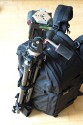 LOWEPRO PRO RUNNER 450 AW\n\nFoto und Text von Sebastian Seth - VIELEN DANK!\n\nKommentar:\n\nier ein kurzer Review zum Lowepro Pro Runner 450 AW:\n \nDer Rucksack ist Lowepro-gewohnt sehr gut verarbeitet und hinterlsst den ersten Eindruck: Sehr leicht und gro!\nDas Tragesystem lsst sich einfach und gut einstellen, sodass der Rucksack auch vollgepackt (!) sehr angenehm zu tragen ist. Der Hftgurt lsst sich hinter dem Rckenpolster verstauen, die Riemen jedoch nicht. Stattdessen kann man diese quasi umkrempeln und auf die Vorderseite ziehen, sodass ein recht kompaktes Format zum Verstauen in Gepckfchern ermglicht wird.\nDie Stativhalterung ist abnehmbar und in zwei verschiedenen Positionen an der Vorderseite oder einer der Seiten ber Sliplock-Schlaufen, die fast berall am Rucksack zu finden sind, befestigen. Fr kompaktere Stative schliet die Halterung so bndig mit dem Rucksack unten ab, sodass dieser noch aufrecht stehen kann. Fr lngere Stative oder ausgedehnte Mrsche kann die Halterung hngend am Rucksack befestigt werden, sodass der Schwerpunkt des Stativs deutlich niedriger ist und weniger Schaukeln des Stativs zu erwarten ist. Fixiert wird das Stativ zustzlich ber drei Gurtschlaufen, von denen zwei am Deckel angebracht sind, der Dritte oben unter dem Griff in einer kleinen Extratasche. Den obersten Gurt muss man allerdings lsen, wenn das Hauptfach geffnet werden soll.\nDas AW-Cover ist auch Lowepro-typisch, ich habe es nicht extra ausgepackt und fotografiert.\nZusatzfcher finden sich auf der Vorderseite (ein kleines und ein groes mit Ordnereinteilung fr Papier und Kleinkram) und an einer Seite (Trinkflaschennetz). Zwischen Hauptfach und Rckenpolsterung ist noch das gut gepolsterte Notebook-Fach. Hier passt tatschlich auch ein groes Notebook rein, getestet sogar das Dell 1720 mit 9-Zellen-Akku.\nInnen im Deckel des Hauptfaches sind verschiedene kleinere Reiverschlusstaschen fr Filter, Akkus, Speicherkarten und sonstiges Zubehr. Die Fcher sind dabei halbtransparent, auf den Bildern sieht man u.a. ein Case fr 77mm Filter durchscheinen.\nDas Hauptfach lsst sich ber die beiliegenden Teiler recht flexibel einrichten und ist ein Platzwunder! Zu Testzwecken habe ich den Rucksack recht locker bepackt mit\nF5 mit angesetztem 28-70mm/3.5-4.5, 300mm/2.8, 80-200mm/2.8, 105mm/2.8, 28-70mm/2.8, 14-24mm/2.8, TC-20E und 16mm/2.8 bereinander, Sb-25, abmontierter Stativhalterung und etwas Zubehr.\nDie Hhe des Faches ist dabei optimal auf Profi-Gehuse bzw. Gehuse mit BG ausgelegt und erlaubt das aufrechte Stellen der meisten Objektive.\n \nAlso rundum ein hervorragender Rucksack fr den Transport mittelgroer bis groer Ausrstungen inklusive (auch greren) Stativen und Full-size Notebook bei sehr gutem Tragekomfort.\n \nSebastian
