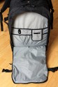 LOWEPRO PRO RUNNER 450 AW\n\nFoto und Text von Sebastian Seth - VIELEN DANK!\n\nKommentar:\n\nier ein kurzer Review zum Lowepro Pro Runner 450 AW:\n \nDer Rucksack ist Lowepro-gewohnt sehr gut verarbeitet und hinterlsst den ersten Eindruck: Sehr leicht und gro!\nDas Tragesystem lsst sich einfach und gut einstellen, sodass der Rucksack auch vollgepackt (!) sehr angenehm zu tragen ist. Der Hftgurt lsst sich hinter dem Rckenpolster verstauen, die Riemen jedoch nicht. Stattdessen kann man diese quasi umkrempeln und auf die Vorderseite ziehen, sodass ein recht kompaktes Format zum Verstauen in Gepckfchern ermglicht wird.\nDie Stativhalterung ist abnehmbar und in zwei verschiedenen Positionen an der Vorderseite oder einer der Seiten ber Sliplock-Schlaufen, die fast berall am Rucksack zu finden sind, befestigen. Fr kompaktere Stative schliet die Halterung so bndig mit dem Rucksack unten ab, sodass dieser noch aufrecht stehen kann. Fr lngere Stative oder ausgedehnte Mrsche kann die Halterung hngend am Rucksack befestigt werden, sodass der Schwerpunkt des Stativs deutlich niedriger ist und weniger Schaukeln des Stativs zu erwarten ist. Fixiert wird das Stativ zustzlich ber drei Gurtschlaufen, von denen zwei am Deckel angebracht sind, der Dritte oben unter dem Griff in einer kleinen Extratasche. Den obersten Gurt muss man allerdings lsen, wenn das Hauptfach geffnet werden soll.\nDas AW-Cover ist auch Lowepro-typisch, ich habe es nicht extra ausgepackt und fotografiert.\nZusatzfcher finden sich auf der Vorderseite (ein kleines und ein groes mit Ordnereinteilung fr Papier und Kleinkram) und an einer Seite (Trinkflaschennetz). Zwischen Hauptfach und Rckenpolsterung ist noch das gut gepolsterte Notebook-Fach. Hier passt tatschlich auch ein groes Notebook rein, getestet sogar das Dell 1720 mit 9-Zellen-Akku.\nInnen im Deckel des Hauptfaches sind verschiedene kleinere Reiverschlusstaschen fr Filter, Akkus, Speicherkarten und sonstiges Zubehr. Die Fcher sind dabei halbtransparent, auf den Bildern sieht man u.a. ein Case fr 77mm Filter durchscheinen.\nDas Hauptfach lsst sich ber die beiliegenden Teiler recht flexibel einrichten und ist ein Platzwunder! Zu Testzwecken habe ich den Rucksack recht locker bepackt mit\nF5 mit angesetztem 28-70mm/3.5-4.5, 300mm/2.8, 80-200mm/2.8, 105mm/2.8, 28-70mm/2.8, 14-24mm/2.8, TC-20E und 16mm/2.8 bereinander, Sb-25, abmontierter Stativhalterung und etwas Zubehr.\nDie Hhe des Faches ist dabei optimal auf Profi-Gehuse bzw. Gehuse mit BG ausgelegt und erlaubt das aufrechte Stellen der meisten Objektive.\n \nAlso rundum ein hervorragender Rucksack fr den Transport mittelgroer bis groer Ausrstungen inklusive (auch greren) Stativen und Full-size Notebook bei sehr gutem Tragekomfort.\n \nSebastian