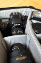 LOWEPRO PRO RUNNER 450 AW\n\nFoto und Text von Sebastian Seth - VIELEN DANK!\n\nKommentar:\n\nier ein kurzer Review zum Lowepro Pro Runner 450 AW:\n \nDer Rucksack ist Lowepro-gewohnt sehr gut verarbeitet und hinterlsst den ersten Eindruck: Sehr leicht und gro!\nDas Tragesystem lsst sich einfach und gut einstellen, sodass der Rucksack auch vollgepackt (!) sehr angenehm zu tragen ist. Der Hftgurt lsst sich hinter dem Rckenpolster verstauen, die Riemen jedoch nicht. Stattdessen kann man diese quasi umkrempeln und auf die Vorderseite ziehen, sodass ein recht kompaktes Format zum Verstauen in Gepckfchern ermglicht wird.\nDie Stativhalterung ist abnehmbar und in zwei verschiedenen Positionen an der Vorderseite oder einer der Seiten ber Sliplock-Schlaufen, die fast berall am Rucksack zu finden sind, befestigen. Fr kompaktere Stative schliet die Halterung so bndig mit dem Rucksack unten ab, sodass dieser noch aufrecht stehen kann. Fr lngere Stative oder ausgedehnte Mrsche kann die Halterung hngend am Rucksack befestigt werden, sodass der Schwerpunkt des Stativs deutlich niedriger ist und weniger Schaukeln des Stativs zu erwarten ist. Fixiert wird das Stativ zustzlich ber drei Gurtschlaufen, von denen zwei am Deckel angebracht sind, der Dritte oben unter dem Griff in einer kleinen Extratasche. Den obersten Gurt muss man allerdings lsen, wenn das Hauptfach geffnet werden soll.\nDas AW-Cover ist auch Lowepro-typisch, ich habe es nicht extra ausgepackt und fotografiert.\nZusatzfcher finden sich auf der Vorderseite (ein kleines und ein groes mit Ordnereinteilung fr Papier und Kleinkram) und an einer Seite (Trinkflaschennetz). Zwischen Hauptfach und Rckenpolsterung ist noch das gut gepolsterte Notebook-Fach. Hier passt tatschlich auch ein groes Notebook rein, getestet sogar das Dell 1720 mit 9-Zellen-Akku.\nInnen im Deckel des Hauptfaches sind verschiedene kleinere Reiverschlusstaschen fr Filter, Akkus, Speicherkarten und sonstiges Zubehr. Die Fcher sind dabei halbtransparent, auf den Bildern sieht man u.a. ein Case fr 77mm Filter durchscheinen.\nDas Hauptfach lsst sich ber die beiliegenden Teiler recht flexibel einrichten und ist ein Platzwunder! Zu Testzwecken habe ich den Rucksack recht locker bepackt mit\nF5 mit angesetztem 28-70mm/3.5-4.5, 300mm/2.8, 80-200mm/2.8, 105mm/2.8, 28-70mm/2.8, 14-24mm/2.8, TC-20E und 16mm/2.8 bereinander, Sb-25, abmontierter Stativhalterung und etwas Zubehr.\nDie Hhe des Faches ist dabei optimal auf Profi-Gehuse bzw. Gehuse mit BG ausgelegt und erlaubt das aufrechte Stellen der meisten Objektive.\n \nAlso rundum ein hervorragender Rucksack fr den Transport mittelgroer bis groer Ausrstungen inklusive (auch greren) Stativen und Full-size Notebook bei sehr gutem Tragekomfort.\n \nSebastian