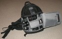 Lowepro SlingShot 300 AW\n\nFoto von Achim Kchler - DANKE VIELMALS!\n\nKommentar des Nutzers:\n\nHallo\nich bin erst krzlich auf Eure hilfreiche Galerie von Taschenbildern gestoen! \nSehr informativ, danke fr diese Zusammenstellung!\n \nDieser Tage habe ich meine Lowepro Slingshot 300 AW bekommen und mchte mich gleich mit Bildern an Eurer Datenbank beteiligen. \n \nDie meisten Fotos der Slingshot-Reihe zeigen diesen Rucksack mit seiner Einteilung so, wie sie vom Hersteller zusammengesteckt wurde. Fr einen schnellen Zugriff auf die Ausrstung ist es meiner Meinung nach gnstiger, die Fcher so anzuordnen, dass man an die Objektive ber die nur an der Schmalseite geffnete Klappe herankommt. So ist man erstens schneller und luft auch weniger Gefahr, dass einem die wertvollen Glser runterfallen.\nDie Slingshot 300 AW habe ich bepackt mit: Kameragehuse und angesetztem Objektiv 24-105, zustzlich kommt man ber die kleine Klappenffnung an folgende Objektive heran: 100-400mm, 17-40mm, 70-200mm, 85mm, 35mm. Unter den beiden zuletzt genannten Festbrennweiten findet noch ein weiteres Objektiv Platz, hier ein 100mm Makroobjektiv. Fr dieses muss man allerdings die Klappe vollstndig ffnen. \nAuf den Bildern ist das mittlere Fach noch mal unterteilt, damit das 70-200er noch hineinpasst. Lsst man diese Unterteilung weg, passt die Kamera besser in die Tasche, falls man den Batteriegriff montiert hat. Beide Telezooms gleichzeitig mitzunehmen macht ohnehin nicht viel Sinn.\n \nEbenfalls dabei: ein Grenvergleich Slingshot 300 gegenber 200. Die Hhe ist gleich geblieben, die 300er ist nur breiter. In der Praxis zeigt sich, dass sich die 300er nicht so verwindet, wenn man sie vom Rcken nach vorn gezogen hat.\n \nGru aus Frankfurt\nAchim Kchler