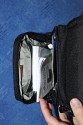 LOWEPRO - TOP LOADER ZOOM AW\n\nFoto von Peter Albrecht - VIELEN DANK!\n\nKommentar:\n\n- gekauft Januar 2009 (scheint auch berarbeitete Version zu sein gegenber dem Model, welches auch auf taschenfreak gezeigt wird)\n  neu: - Reisverschlu innen im Deckel hat jetzt eine Schutzkappe (Bild 06)\n       - SlipLock auf beiden Seiten (Bilder 02 und 04)\n\n- Beigaben:\n  - Schultergurt (Bild 05)\n  - Chest Harness (4 Kunststoffhaken) (Bild 05)\n      - Chest Harness, den man als extra Zubehr erwerben kann hat fr die oberen Ringe zwei Metallhaken\n      - Gurte lassen sich schnell und einfach verstellen\n      - keine Anleitung => erst mal experimentieren, aber man kriegs relativ schnell hin\n  - klitzekleine Anleitung fr die Tasche selbst (englisch / franzsisch / kein Deutsch)\n  - Werbeschild 30 Jahre Lowepro (ist dann wohl schon etwas lter) (Bild 01)\n\n- Innenraum mit 4 Trennern veriabel gestaltbar (Bilder 05, 07, 08 und 09)\n- beim 18-55mm Objektiv kann man problemlos das Ladegert fr die Akkus unter einem doppelten Boden verstauen (Bild 09)\n- die zwei groen Trenner haben noch seitliche Taschen fr Kleinzeugs (z.B. Akkus) (Bilder 05 und 08)\n- Zwei SlipLock Schlaufen (je eine links und rechts) (Bilder 02 und 04)\n- die oberen zwei Ringe zur Befestigung des Tragesystems sind aus Metall, die unteren aus Kunststoff, aber die sind ja nicht so wichtig.\n\n- Was geht rein?\n  - Canon 500D mit Batteriegriff und Tragegurt (Bild 06)\n  - Speedlite 430 EX II + Ersatzakkus + Zweitakku fr Camera (Bild 08)\n  - Ladegert (Bild 09)\n  - Zettel und Speicherkarte (Bild 10)\n  - Anleitungen fr Speedlite und 500D, Stifte, Taschenlampe (Bild 11)\n  - Mignon-Halter fr den Batteriegriff - aber UNGEPOLSTERT! (Bild 12)\n\n\n- All-Weather-Cover (AWC): (Bilder 13 - 16)\n  - Ringe und Gurtschlaufe fr Tragesysteme bleiben frei\n  - Deckel, Fronttasche, Seitentasche sind eingepackt (kein Zugang)\n  - SlipLock auch bei AWC verwendbar\n  - Tragsystem mu vor dem Aufziehen des AWC nicht entfernt werden\n  - Seite am Krper und die Hlfte der linken/rechten Seite (Sliplock) bleiben frei\n  - AWC ber langes Band fest mit Tasche vernht -> kein Verlieren\n\nNegativ:\n- Toploader-Deckel (geschwungen) pat zur Kamera-Form (eher flach) (Bild 17)\n- Blitznase spreitzt sich beim Einlegen an Klettverschlubasis (mit der Zeit lernt man aber, wie mans gut rein bringt)\n- Klettverschlu fr Innenraumteiler aufgenht -> sieht nicht so toll aus und man kann beim Einpacken daran hngen bleiben (EOS 500D) (Bilder 07 und 08)\n- Im Vergleich zum Toploader Pro 70 AW hat der Zoom AW eher ein Plastik-Feeling (besonders die Tasche im Deckel) (Bild 09)\n- Fronttasche garnicht gepolstert -> keine empfindlichen Sachen verstauen\n - im oberen Teil ist das AWC zwischen Tascheninhalt und auen (Bild 11)\n - unten gibts nur ein ungepolstertes Stck Stoff, den Mignon-Halter fr den Batteriegriff sollte man da NICHT transportiern (Bild 12)