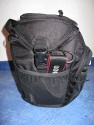 LOWEPRO TOPLOADER PRO 70 AW\n\nFoto und Text von Peter Albrecht - VIELEN DANK!\n\nKommentar:\n\n- gekauft Januar 2009 (vermutlich der Nachfolger des "Toploader 70 AW" - ohne "Pro")\n  - Unterschied zum "ohne Pro": \n     - Deckel klappt jetzt nach links weg anstatt nach vorne.\n     - hat nur noch auf einer Seite (links) Sliplock-Erweiterungsmglichkeit\n     - statt der Sliplock rechts, gibts jetzt eine Auentasche, die mit Gummi oben "gesichert" ist\n		- es gibt aber (Stand Januar 2009) auch noch den "ohne Pro" frs gleiche Geld im Internet\n\n- Beigaben:\n  - Dreipunkt Gurt zum tragen (Bild 01)\n  - klitzekleine deutsche Anleitung\n  - Werbeschild 40 Jahre Lowepro (mte der Aktuelle Stand sein)\n\n- Camera (500D) sitzt fest in der Tasche\n- Innenraum mit 2 Trennern verstellbar (Bilder 09, 10 und 11)\n- bleibt grundsttzlich sogar aufrecht stehen (ist aber nicht besonders stabil, besser hinlegen)\n- Karabiner des Schultergurtes aus Metall\n- mit ein bichen Gefummel, kann man auch die Cameratasche fr die PowerShot in der SlingShot Schlaufe einhngen (Bild 18)\n- Schnellverschlu (keine Reisverschlsse notwendig, um nur die Kamera zu halten)\n- Cameragurt kann man entweder mit in die Tasche rein packen (Bilder 07 und 08), oder raus hngen lassen und ggf in die \n Auentasche packen (Bilder 05 und 06).\n\n- Was pat rein? (Bild 16)\n  - Canon 500D mit Batteriegriff und Tragegurt (Bilder 05 und 07)\n  - Ladegert (unter doppeltem Boden) (Bild 12)\n  - Mignon-Halter fr den Batteriegriff (Bild 13)     - \n  - Speedlite 430 EX II + Zweitakku fr Camera (Bild 14)\n  - Zettel, Speicherkarte, Blitz Ersatzakkus, Anleitungen fr Speedlite und 500D  (Bild 15)\n  - Stifte (Bild 17)\n  - (PowerShot, aber ungepolster) (Bild 17)\n\n- All-Weather-Cover (AWC): (Bilder 20 bis 23)\n  - Ringe und Gurtschlaufe fr Tragesysteme bleiben frei\n  - Deckel lt sich ffnen (wrd ich bei strmenden Regen nicht machen)\n  - Fronttasche, Seitentasche sind zugepackt (kein Zugang)\n  - SlipLock und AWC sind NICHT gleichzeitig verwendbar\n  - Tragsystem mu vor dem Aufziehen des AWC entfernt werden\n  - Nur die Seite am Krper bleibt frei\n  - AWC ber langes Band fest mit Tasche vernht -> kein Verlieren\n\nNegativ:\n- Anleitung fr Schultertragegurt fehlt. (siehe http://www.lowepro-deutschland.de/videos/flvplayer/video_toploader.html)\n- nur eine Sliplock Schlaufe (linke Seite vom Krper aus gesehen)\n- beim Tragen am 3-Punkt-Gurt ist der Toploader bei den ersten Versuchen dem linken Arm im Weg. Vielleicht findet sich durch etwas experimentieren eine bessere Position.\n\nKombination mit dem "Lowepro Chest Harness" ist nicht bequem!\n- Da der Toploader-Deckel nach links aufgeht, sind die oberen Ringe frs Tragesystem sehr nah am Krper; \n Beim Tragen am Chest Harness kippt der obere Teil der Tasche dadurch nach vorne weg, da das Tragesystem keinen\n Zug zum Kper hin erzeugen kann. Dies wiederum resultiert darin, da die untere Kante der Tasche in den \n Bauch drckt, anstatt da das ganze Rckenteil der Tasche flach aufliegt. Dadurch ist das Tragen am Chest\n Harness nicht ganz so bequem. (Der "Toploader Zoom AW" z.B. schmiegt mit dem Chest Harness viel angenehmer \n an den Brustkorb)\n- Besser: Toploader mit kleinen Karabinern an einem Rucksack festmachen. (Bild 19). Vielleicht ist auch der \n "Tamrac S-500 Chest Harness System" geeignet. Auf dem Produktbild sieht es jedenfalls so aus.