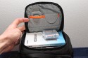 LOWEPRO TOPLOADER PRO 70 AW\n\nFoto und Text von Peter Albrecht - VIELEN DANK!\n\nKommentar:\n\n- gekauft Januar 2009 (vermutlich der Nachfolger des "Toploader 70 AW" - ohne "Pro")\n  - Unterschied zum "ohne Pro": \n     - Deckel klappt jetzt nach links weg anstatt nach vorne.\n     - hat nur noch auf einer Seite (links) Sliplock-Erweiterungsmglichkeit\n     - statt der Sliplock rechts, gibts jetzt eine Auentasche, die mit Gummi oben "gesichert" ist\n		- es gibt aber (Stand Januar 2009) auch noch den "ohne Pro" frs gleiche Geld im Internet\n\n- Beigaben:\n  - Dreipunkt Gurt zum tragen (Bild 01)\n  - klitzekleine deutsche Anleitung\n  - Werbeschild 40 Jahre Lowepro (mte der Aktuelle Stand sein)\n\n- Camera (500D) sitzt fest in der Tasche\n- Innenraum mit 2 Trennern verstellbar (Bilder 09, 10 und 11)\n- bleibt grundsttzlich sogar aufrecht stehen (ist aber nicht besonders stabil, besser hinlegen)\n- Karabiner des Schultergurtes aus Metall\n- mit ein bichen Gefummel, kann man auch die Cameratasche fr die PowerShot in der SlingShot Schlaufe einhngen (Bild 18)\n- Schnellverschlu (keine Reisverschlsse notwendig, um nur die Kamera zu halten)\n- Cameragurt kann man entweder mit in die Tasche rein packen (Bilder 07 und 08), oder raus hngen lassen und ggf in die \n Auentasche packen (Bilder 05 und 06).\n\n- Was pat rein? (Bild 16)\n  - Canon 500D mit Batteriegriff und Tragegurt (Bilder 05 und 07)\n  - Ladegert (unter doppeltem Boden) (Bild 12)\n  - Mignon-Halter fr den Batteriegriff (Bild 13)     - \n  - Speedlite 430 EX II + Zweitakku fr Camera (Bild 14)\n  - Zettel, Speicherkarte, Blitz Ersatzakkus, Anleitungen fr Speedlite und 500D  (Bild 15)\n  - Stifte (Bild 17)\n  - (PowerShot, aber ungepolster) (Bild 17)\n\n- All-Weather-Cover (AWC): (Bilder 20 bis 23)\n  - Ringe und Gurtschlaufe fr Tragesysteme bleiben frei\n  - Deckel lt sich ffnen (wrd ich bei strmenden Regen nicht machen)\n  - Fronttasche, Seitentasche sind zugepackt (kein Zugang)\n  - SlipLock und AWC sind NICHT gleichzeitig verwendbar\n  - Tragsystem mu vor dem Aufziehen des AWC entfernt werden\n  - Nur die Seite am Krper bleibt frei\n  - AWC ber langes Band fest mit Tasche vernht -> kein Verlieren\n\nNegativ:\n- Anleitung fr Schultertragegurt fehlt. (siehe http://www.lowepro-deutschland.de/videos/flvplayer/video_toploader.html)\n- nur eine Sliplock Schlaufe (linke Seite vom Krper aus gesehen)\n- beim Tragen am 3-Punkt-Gurt ist der Toploader bei den ersten Versuchen dem linken Arm im Weg. Vielleicht findet sich durch etwas experimentieren eine bessere Position.\n\nKombination mit dem "Lowepro Chest Harness" ist nicht bequem!\n- Da der Toploader-Deckel nach links aufgeht, sind die oberen Ringe frs Tragesystem sehr nah am Krper; \n Beim Tragen am Chest Harness kippt der obere Teil der Tasche dadurch nach vorne weg, da das Tragesystem keinen\n Zug zum Kper hin erzeugen kann. Dies wiederum resultiert darin, da die untere Kante der Tasche in den \n Bauch drckt, anstatt da das ganze Rckenteil der Tasche flach aufliegt. Dadurch ist das Tragen am Chest\n Harness nicht ganz so bequem. (Der "Toploader Zoom AW" z.B. schmiegt mit dem Chest Harness viel angenehmer \n an den Brustkorb)\n- Besser: Toploader mit kleinen Karabinern an einem Rucksack festmachen. (Bild 19). Vielleicht ist auch der \n "Tamrac S-500 Chest Harness System" geeignet. Auf dem Produktbild sieht es jedenfalls so aus.