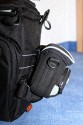 LOWEPRO TOPLOADER PRO 70 AW\n\nFoto und Text von Peter Albrecht - VIELEN DANK!\n\nKommentar:\n\n- gekauft Januar 2009 (vermutlich der Nachfolger des "Toploader 70 AW" - ohne "Pro")\n  - Unterschied zum "ohne Pro": \n     - Deckel klappt jetzt nach links weg anstatt nach vorne.\n     - hat nur noch auf einer Seite (links) Sliplock-Erweiterungsmglichkeit\n     - statt der Sliplock rechts, gibts jetzt eine Auentasche, die mit Gummi oben "gesichert" ist\n		- es gibt aber (Stand Januar 2009) auch noch den "ohne Pro" frs gleiche Geld im Internet\n\n- Beigaben:\n  - Dreipunkt Gurt zum tragen (Bild 01)\n  - klitzekleine deutsche Anleitung\n  - Werbeschild 40 Jahre Lowepro (mte der Aktuelle Stand sein)\n\n- Camera (500D) sitzt fest in der Tasche\n- Innenraum mit 2 Trennern verstellbar (Bilder 09, 10 und 11)\n- bleibt grundsttzlich sogar aufrecht stehen (ist aber nicht besonders stabil, besser hinlegen)\n- Karabiner des Schultergurtes aus Metall\n- mit ein bichen Gefummel, kann man auch die Cameratasche fr die PowerShot in der SlingShot Schlaufe einhngen (Bild 18)\n- Schnellverschlu (keine Reisverschlsse notwendig, um nur die Kamera zu halten)\n- Cameragurt kann man entweder mit in die Tasche rein packen (Bilder 07 und 08), oder raus hngen lassen und ggf in die \n Auentasche packen (Bilder 05 und 06).\n\n- Was pat rein? (Bild 16)\n  - Canon 500D mit Batteriegriff und Tragegurt (Bilder 05 und 07)\n  - Ladegert (unter doppeltem Boden) (Bild 12)\n  - Mignon-Halter fr den Batteriegriff (Bild 13)     - \n  - Speedlite 430 EX II + Zweitakku fr Camera (Bild 14)\n  - Zettel, Speicherkarte, Blitz Ersatzakkus, Anleitungen fr Speedlite und 500D  (Bild 15)\n  - Stifte (Bild 17)\n  - (PowerShot, aber ungepolster) (Bild 17)\n\n- All-Weather-Cover (AWC): (Bilder 20 bis 23)\n  - Ringe und Gurtschlaufe fr Tragesysteme bleiben frei\n  - Deckel lt sich ffnen (wrd ich bei strmenden Regen nicht machen)\n  - Fronttasche, Seitentasche sind zugepackt (kein Zugang)\n  - SlipLock und AWC sind NICHT gleichzeitig verwendbar\n  - Tragsystem mu vor dem Aufziehen des AWC entfernt werden\n  - Nur die Seite am Krper bleibt frei\n  - AWC ber langes Band fest mit Tasche vernht -> kein Verlieren\n\nNegativ:\n- Anleitung fr Schultertragegurt fehlt. (siehe http://www.lowepro-deutschland.de/videos/flvplayer/video_toploader.html)\n- nur eine Sliplock Schlaufe (linke Seite vom Krper aus gesehen)\n- beim Tragen am 3-Punkt-Gurt ist der Toploader bei den ersten Versuchen dem linken Arm im Weg. Vielleicht findet sich durch etwas experimentieren eine bessere Position.\n\nKombination mit dem "Lowepro Chest Harness" ist nicht bequem!\n- Da der Toploader-Deckel nach links aufgeht, sind die oberen Ringe frs Tragesystem sehr nah am Krper; \n Beim Tragen am Chest Harness kippt der obere Teil der Tasche dadurch nach vorne weg, da das Tragesystem keinen\n Zug zum Kper hin erzeugen kann. Dies wiederum resultiert darin, da die untere Kante der Tasche in den \n Bauch drckt, anstatt da das ganze Rckenteil der Tasche flach aufliegt. Dadurch ist das Tragen am Chest\n Harness nicht ganz so bequem. (Der "Toploader Zoom AW" z.B. schmiegt mit dem Chest Harness viel angenehmer \n an den Brustkorb)\n- Besser: Toploader mit kleinen Karabinern an einem Rucksack festmachen. (Bild 19). Vielleicht ist auch der \n "Tamrac S-500 Chest Harness System" geeignet. Auf dem Produktbild sieht es jedenfalls so aus.