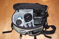 Sarfrotto L400\n\nFoto von Jrg Langer\n\nKommentar/Details:\n\nSehr hochwertige Profi-Fototasche\nvon Sarfrotto L 400 - All Weather kompatibel\n\nSuper Qualitt zum gnstigen Preis!\n- Sicherheit fr Ihre Kamera, beste Polsterung!\n- Komplett variables, gepolstertes Innenfach\n- Schutz vor Regen, Staub, Schnee!\n- Regenhaube zum berstlpen!\n- Schneller Zugriff zur Kamera durch einen Rei-\nverschluss in der Mitte\n- Lasche zum Durchfhren eines Waistbelts\n- Sehr Gut gepolsterter Gurt\n- Ideal fr den Profieinsatz\n- Innenpolster herausnehmbar\n- Trennfcher knnen mit Klettverschluss ange-\nordnet werden\n\nBeschreibung\nDiese sehr leichten und hochwertigen Fototaschen sind sehr gut vearbeitet und bieten optimalen Schutz fr Ihre Kameraasurstung - und das bei praktischer und einfacher Handhabung.\n\nBesonders gelungen ist der weiche Gurt, er erlaubt bequemes Tragen der Fotoausrstung. Der in der Mitte der Tasche liegende Reiverschluss ist super, fr den schnellen Zugriff zur Kamera.\nDie Tasche bieten Schutz vor Regen, Staub, Schnee, etc.\n\nDie Tasche ist kompatibel mit den Waistbelts anderer Markenhersteller - die Weistbelts (Hftgrtel) lassen sich ganz einfach durch die Lasche am hinteren Ende der Kamera ziehen.\n\nBei Bedarf kann das gepolsterte Innenfach herausgenommen werden. Die Tasche wird dadurch noch leichter und weicher.\n\nRegencover\n\nDetails der L 400:\n- Praktischer Tragegriff\n- Seitliche Laschen zum anschlieen von Kchern, o..\nMit Festzurrschlaufe zum fixieren der Kcher!\n- Gerumige Vordertasche fr Ladegerte, Speicher, Film,\nAkkus, etc. - eingeteilt in versch. Fcher.\n- Herausnehmbare Regenhaube fr noch mehr Schutz\n- variable Fcher im gepolsterten Innenfach\n- 2x Innenliegendes Geheimfach hinter der Polsterung\n- Gurtschlaufe hinten fr Waistbelts\n- Bequemer, gepolsterter Gurt\n\nFassungsvermgen:\nSiehe Details auf den Bildern\n\nMae\nInnen: ca. 32x17,5x25cm\nAuen: ca. 35x25x27,5cm