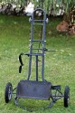 EIGENBAU TROLLY\n\nFoto von Frank Bhler - VIELEN DANK FR DEINE MAILS!\n\nKommentar des Nutzers:\n\nNach dem die Suche nach einer fertigen Lsung erfolglos war habe ich mir meinen Trolly selbst gebaut. \n\n# groe Rder mit Luftbereifung (stammen von einem Kinderwagen).\n\n# der Lowepro Foro Trekker wird einfach angehngt, sttzt sich in einer Wanne (war mal ein Hydrokultur-Blumentopf) und sitzt "bombenfest".\n\n# darber kann eine Lowepro Reporter 200 montiert werden \n\n# sollte der Stauraum noch immer nicht reichen ...einfach die LensCase an der Tasche anbringen.\n\n# das Stativ braucht natrlich auch seinen Platz. Um es mglichst schnell griffbereit zu haben wird's nur eingehngt.\n\n# Auch die dicke Linse sollte schnell zur Hand sein (einen Sicheren Platz soll sie aber auch haben...damit ihr nix passiert :O)\n\n# Damit das Ding auch in den Kofferaum pat ist der "Fu" klappbar.\n\n# Um Dinge auch leicht und sicher aus dem Rucksack holen zu knnen, ohne da Gefahr besteht, da was auf den Boden kullert (schne L-Linsen oder so was :O) gibt es eine weitere Sttze. Durch eine "Reisleine" etwas "automatisiert".\n\n...was meint Ihr zu dem Ding?\n\nMfG\nFrank