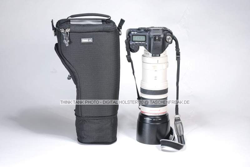 THINK TANK PHOTO - DIGITAL HOLSTER 10\n\nFOTO VON ISARFOTO & THINK TANK PHOTO - VIELEN DANK!\n\nKommentar des Herstellers:\n\n\nDigital Holster 30 - Thats tall!\n\nDesigned for digital SLRs, such as the Canon 5D, 10D, 20D, and 30D, and the Nikon D70, D80, and D200. This is the only top loading bag for an SLR being sold that can hold a 70-200 2.8 with the hood either in position or ready to shoot. An industry first!