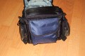 WEIFENG Medium\n\nFoto von Jörg Langer\n\nKommentar zu dieser Tasche:\n\nDiese relativ kleine und sehr günstige Tasche ist sehr hochwertig verarbeitet mit Liebe zum Detail.\n\nViele kleine Fächer für die Dinge des Täglichen Lebens, wie Schlüssel, Speicher, Handy, PDA, Akkus und dazu noch genügend Platz für eine relativ große DSLR mit relativ großem Objektiv. \n\nHier passt prima eine relativ kleine DSLR mit Kitobjektiv wie eine 350D oder eine 400D aus dem Hause Canon oder eine Nikon 50D oder ahnliche rein. Für unsere 5D mit L Winkel ist die Tasche zu klein.\n\nUnsere Meinung: Diese Tasche ist mehr wert als nur 21,99€ - wer eine kleine unauffällige Tasche für das kleine Gepäck sucht ist hier bestens beraten.